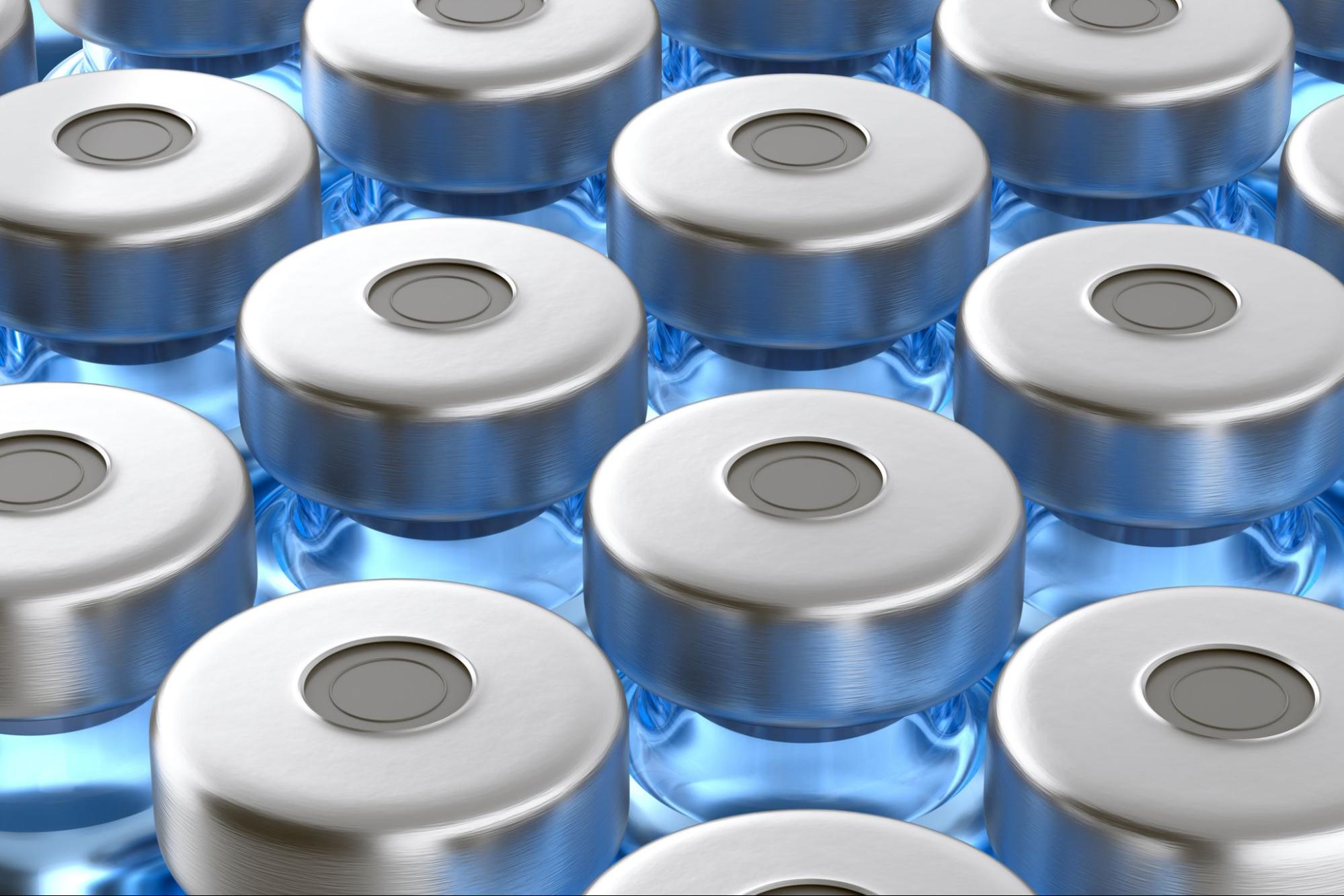 Injection vaccine in blue glass pharmacy vial bottles